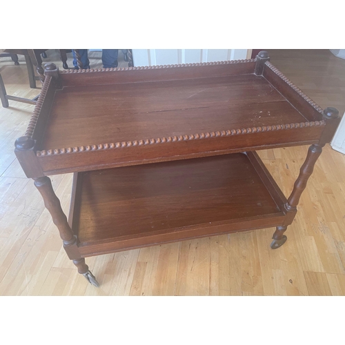 291 - VINTAGE! A nice wooden two-tier tea trolley on wheels - dimensions 2.5ft length x 18