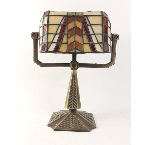 359 - An unusual Tiffany-style tealight holder with pivoting shade, stands 26cm high approx, 20cm width. A... 