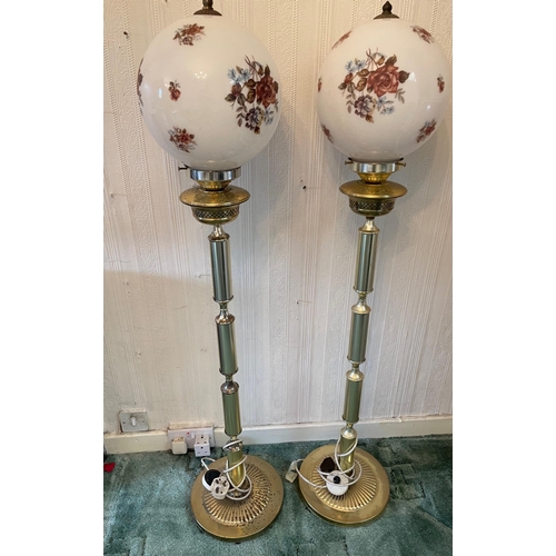 362 - A pair of electric half standard floor glass globe lamps, the brass base on one is pitted with rust,... 