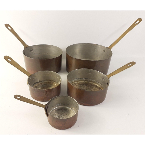 449 - A set of five vintage copper pans with tin lining and brass handles, ranging from 17cm down to 7cm d... 