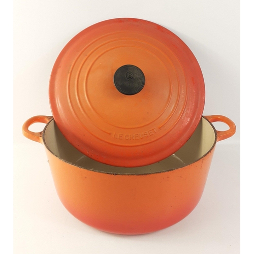 450 - LE CREUSET 28cm cast iron round volcanic orange lidded casserole dish in good useable condition.   M... 