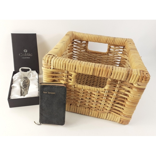 471 - A wicker basket with a small New Testament and a CELTIC COLLECTION boxed presentation bottle opener.... 