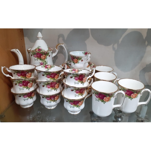 A ROYAL ALBERT Country Roses coffee and tea set comprising a coffee pot