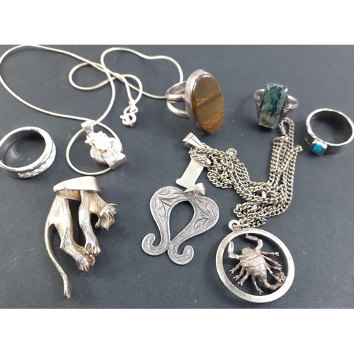 42 - A small bag of assorted 925 stamped silver to include a leopard pendant, and a lobster pendant on ch... 