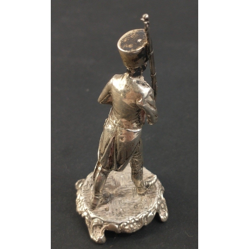 66A - A SILVER stamped and Hallmarked marching dragoon foot soldier on a silver base - weight 50.50g appro... 