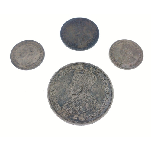 67 - Four silver coins to include 1913 florin in good condition with a touch of verdigris, total weight 1... 