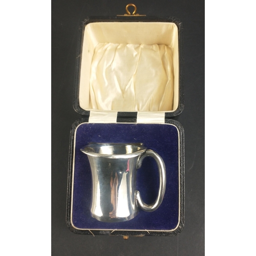 111 - A small boxed tankard, silver hallmarked for Birmingham 1929, stands 6cm high, weight 61g approx, ha... 