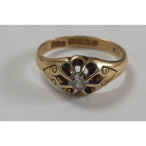 12 - An 18ct stamped yellow gold ring with a solitaire diamond centred - gross weight 4.30g approx - ring... 