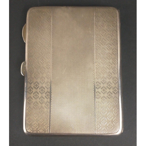 120 - A VINTAGE SILVER hallmarked engine turned cigarette case in good order with gilt interior and origin... 