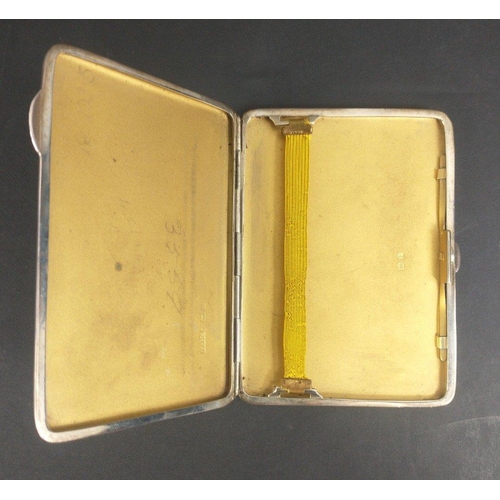 120 - A VINTAGE SILVER hallmarked engine turned cigarette case in good order with gilt interior and origin... 