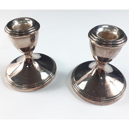 124 - A lovely pair of small 8cm SOLID SILVER candle stick holders with felt bases with hallmarks for Birm... 