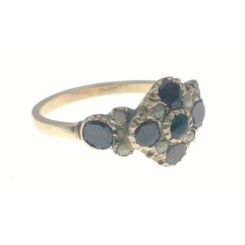 14 - An unmarked ‘yellow metal' vintage jet/set ring in floral form with a green set centred stone ... 