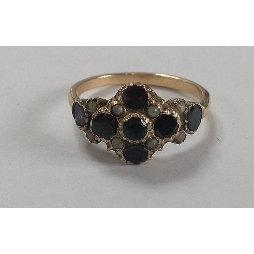 14 - An unmarked ‘yellow metal' vintage jet/set ring in floral form with a green set centred stone ... 