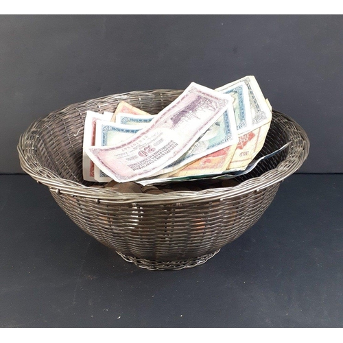 161 - A silvered wicker style basket with a quantity of obsolete UK and World coinage and banknotes.  Nice... 