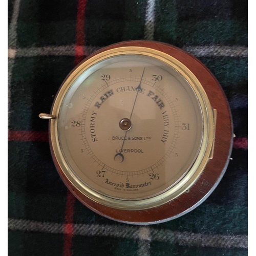 175 - ANTIQUE CIRCA 1920's BRASS CASED ANEROID BAROMETER on a mahogany mount - diameter 25cm diameter x 12... 