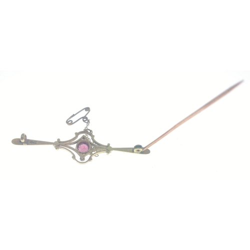 18 - Yellow metal bar brooch stamped 15ct with pink centre stone and four seed pearls and safety chain. 5... 