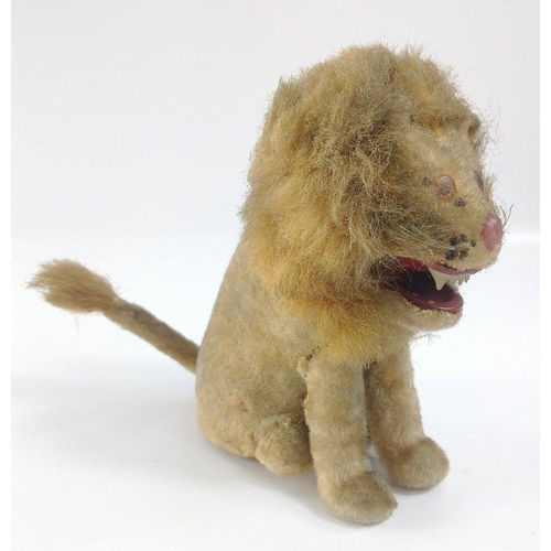 196 - LOVE LEO! VINTAGE felt covered tinplate clockwork LION with wagging tail.  Strong motor works well, ... 