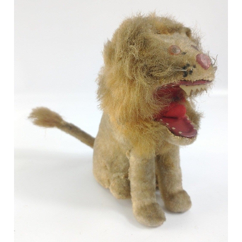 196 - LOVE LEO! VINTAGE felt covered tinplate clockwork LION with wagging tail.  Strong motor works well, ... 