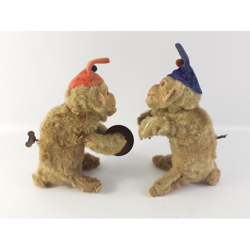 197 - A pair of mid-century clockwork MONKEYS.  One with cymbals but the other is missing his drum.  Both ... 