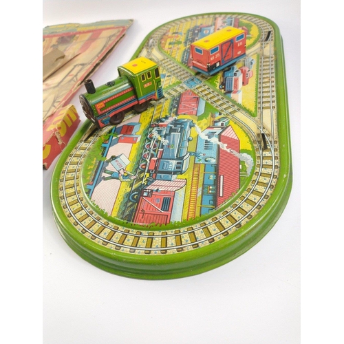 211 - Vintage TECHNOFIX magic shunting train track, loco and guards van.  Box lid only, missing key.  Trac... 