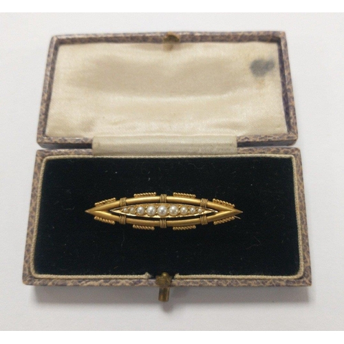 23 - VICTORIAN - A 15c stamped yellow gold brooch with seed pearls inset - gross weight 2.95g approx - di... 