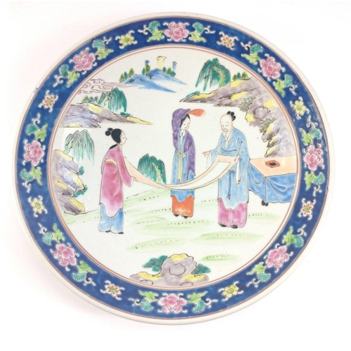 237 - A large vintage Oriental charger with lovely colourful art work. Appears to be a scene of artists fo... 