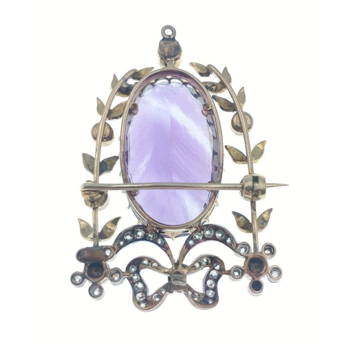 24 - EXQUISITE- 
A top quality large Victorian purple oval shaped AMETHYST and diamond studded with flora... 