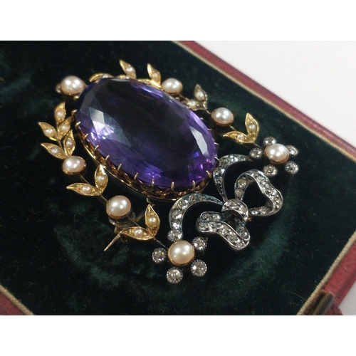 24 - EXQUISITE- 
A top quality large Victorian purple oval shaped AMETHYST and diamond studded with flora... 