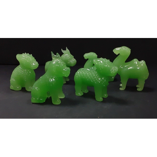 245 - Six jadeite style animals including four of the monkey god in various poses and 2 dromedaries, one s... 