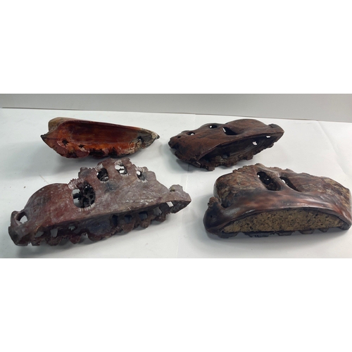 284 - A lovely group of Chinese red soapstone pieces.  Four have intricate floral designs in addition to p... 