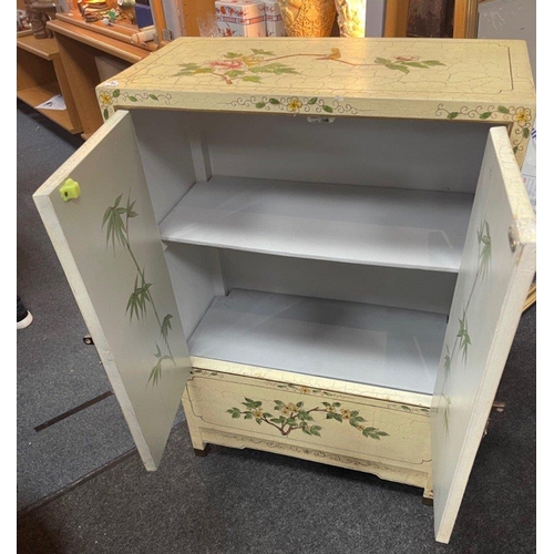 285 - A distressed ORIENTAL two door cabinet painted in pale lemon background with flora and fauna wild sc... 