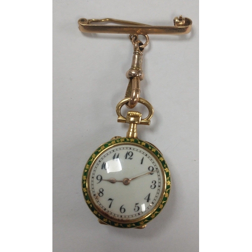 32 - VINTAGE! 
An 18ct 750 stamped and a decorative green enamel back pretty pinafore nurses watch with a... 