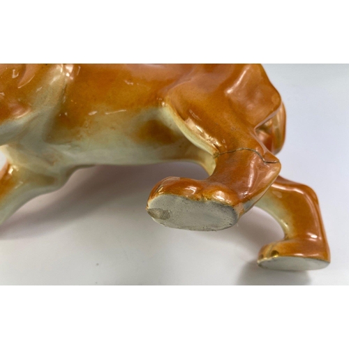 326 - A standing Victorian Staffordshire pottery lion, c. 1880, rear leg damage repaired, tiny chip on und... 