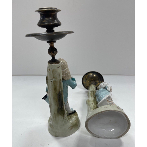 329 - A pair of ceramic based candlesticks with brass candle holders, each standing approx 23cm high#329... 