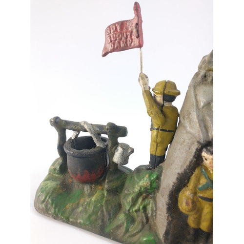 387 - A cast iron reproduction money box of a Boy Scout Camp.  In good condition, flag works well. 23cm lo... 