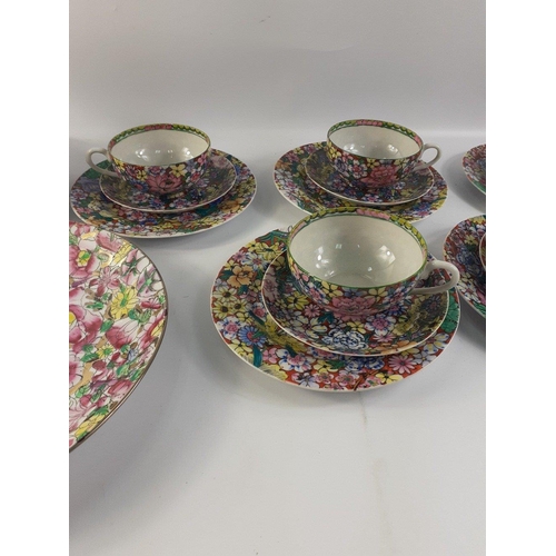 412 - A highly decorative tea service in fine delicate china, decorated in Hong Kong comprising 7 cups, (1... 