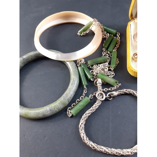 42 - VINTAGE! A small group of costume jewellery to include an EP fork made into a bangle, a green stone ... 