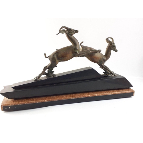 423 - An impressive ART DECO marble based bronzed model of leaping Gazelles.  A substantial 54cm across at... 