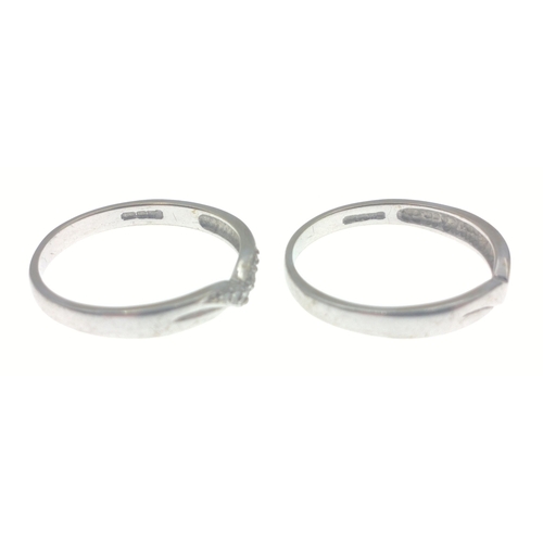 5 - A box containing two rings.  One with a wishbone style with diamond chips stamped 375 size P gross w... 