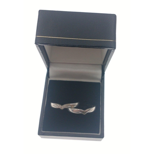 5 - A box containing two rings.  One with a wishbone style with diamond chips stamped 375 size P gross w... 