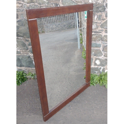 546 - A large wooden framed mirror measuring 123cm x 92cm#545