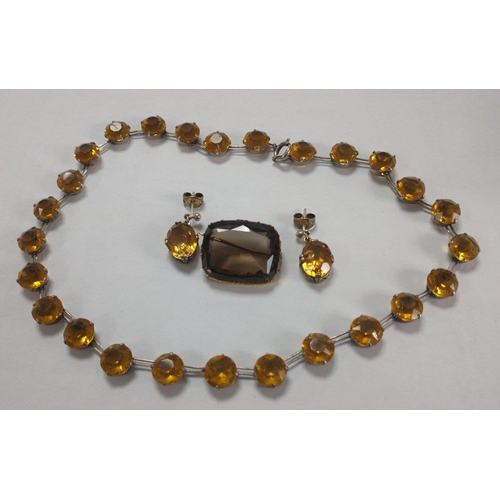 55 - A STERLING SILVER stamped and amber-like stones VINTAGE necklace with a pair of similar white metal ... 