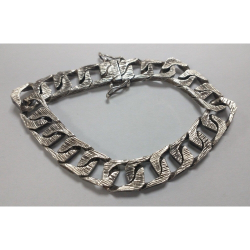 57 - A silver hallmarked modern square cut chainlink bracelet, weight 32.85g approx, 18cm long approx#57... 