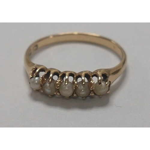 6 - A 14K marked gold ring with 5 pretty seed pearls to top of band. Size N, total gross weight 2g appro... 