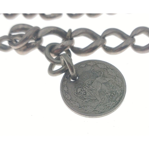 60 - A VINTAGE CONTINENTAL unmarked pocket watch chain with a Continental coin and bar - weight 44.30g ap... 