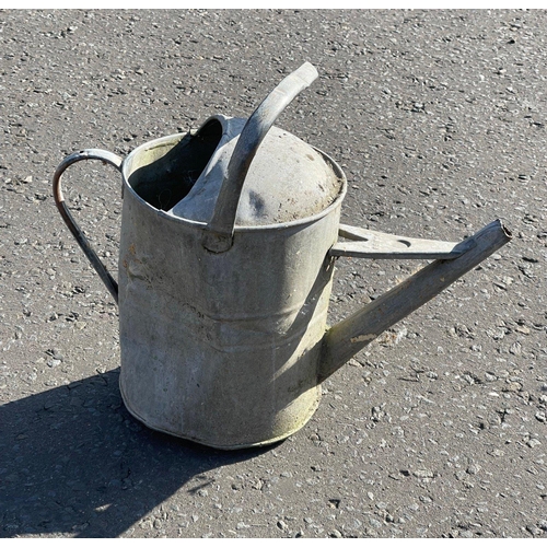 628 - A galvanised watering can - a great garden feature! - the handle is a bit bent but otherwise a sturd... 