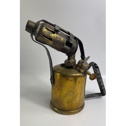 633 - A brass hand held blow torch standing 21cm tall.  No.31 stamped on handle made by BURMOS.  Interesti... 