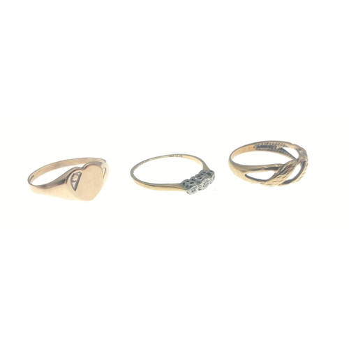 7 - Three rings.  One with three small diamond chips and marked 18ct Plat size N 1.3g approx, one yellow... 