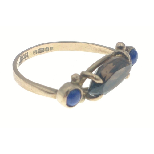 9 - A 375 stamped yellow gold ring with two unusual blue stones with a larger Smokey quartz stone centre... 