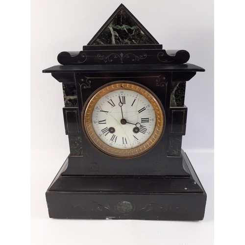 156 - An impressive and solid black slate mantle clock.  Stands 32cm tall. Age related cracks to the ename... 